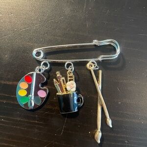 Fun artist’s brooch